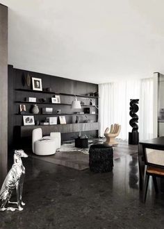 a modern living room with black and white decor