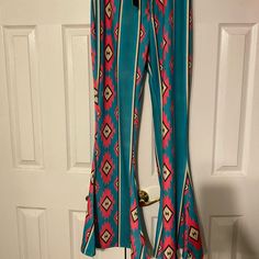 Nwt Aztec Flare Pants From Boutique. Colors Are Turquoise, Bright Pink,Tan And Black. Perfect Condition. Very Cute And Western. Trendy Blue Festival Pants, Trendy Blue Pants For Festival, Turquoise Stretch Bottoms, Stretch Turquoise Bottoms For Spring, Fitted Blue Pants For Vacation, Casual Fitted Turquoise Pants, Fitted Turquoise Casual Pants, Boutique Colors, Gold Sequin Pants