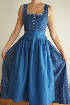 Beautiful blue dress in 100% cotton. Closes with buttons at the front. The dress is in blue with white little flower prints and has a blue apron. Ask for measures. Size: XS / S Model is 1,71 cm tall and wears size S for reference. "Please keep in mind that all pieces listed are true vintage, so they can come with some usual signs of vintage wear." You can follow us on instagram: @dracaena_vintage Shipping: Order processing and shipping time ranges from 5 to 7 days. I am not responsible for delay Bavarian Dress, Puff Sleeves Dress, Folk Dress, Blue Apron, Folk Dresses, Flower Blue, Sleeves Dress, Vintage Wear, True Vintage