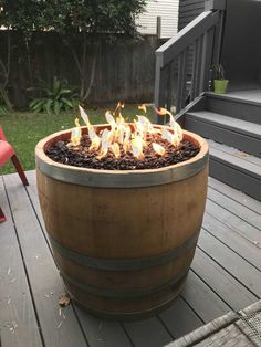 a fire pit sitting on top of a wooden deck