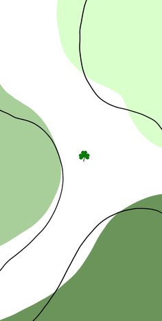 an aerial view of a tree in the middle of a green field with white lines