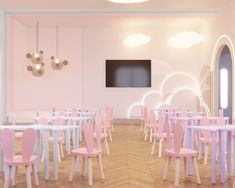 a pink and white dining room with wooden flooring, round chandeliers and pastel colored chairs