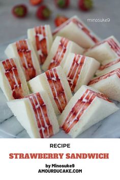 strawberry shortcakes on a plate with strawberries in the background