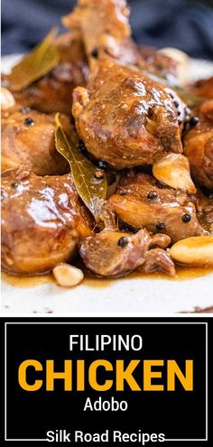 a close up of food on a plate with the words chicken adobo above it