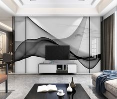 the living room is decorated in black and white with an abstract design on the wall