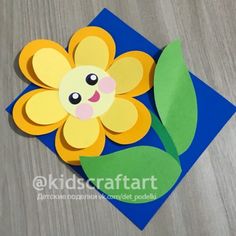 the paper flower is cut out to look like it's made from construction paper