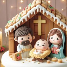 a nativity scene with figurines and cookies in the shape of a house