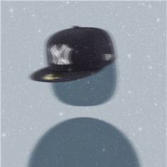 a new york yankees baseball cap is shown in the snow