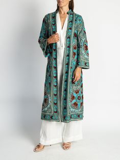 The must-have jacket this season. These embroidered suzani jackets bring traditional textile techniques to modern fashion with a timeless cut and impeccable detail. Suzani fabric hand-embroidered, made in Samarkand, Uzbekistan Coat tailored in Istanbul, Turkey Dry clean only One size fits most Model is 5'4" and wears a size 2. Samarkand Uzbekistan, Turkish Clothing, Textile Techniques, Suzani Fabric, Textiles Techniques, Long Jacket, Istanbul Turkey, Silk Velvet, Modern Fashion