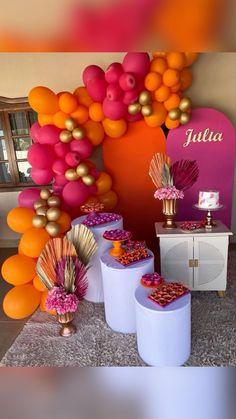 there are many balloons and decorations on the wall in this party decoration set up for an event