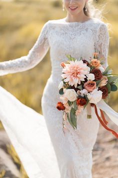 a woman in a wedding dress holding a bouquet