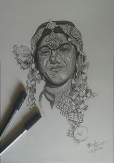 a pencil drawing of a woman's face with flowers on her head and two pens next to it