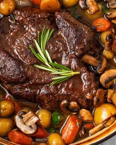 a pot roast with mushrooms, carrots and potatoes