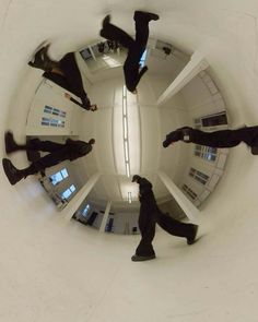 four people are standing in a circular mirror