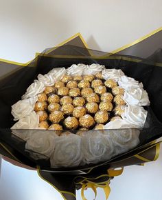 a bouquet of chocolates wrapped in black paper