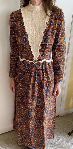 HANDMADE in 1975. This is a Late 1800's Style Period Costume Brown Multicolor Dress. Model is Size 4.  Features lace motif  in front of bodice. Zips up in the back. Has stand up collar. Measures 18 inches from armpit to armpit. Waist is 28 inches and the length is 53 inches with a 2 inch hem. Perfect, excellent condition. Vintage Dresses With Lace Patchwork For Daywear, Vintage Lace Work Dress For Daywear, Retro Vintage Lace Dress For Daywear, Retro Lace Casual Dress, Vintage Lace Trim Dress For Daywear, Retro Long Sleeve Lace Vintage Dress, Retro Daywear Dress With Lace Trim, Retro Lace Vintage Dress For Vintage Fashion, Retro Lace Vintage Dress