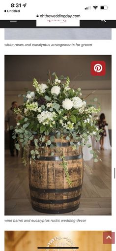 a wooden barrel with flowers and greenery in it is on the web page for an article