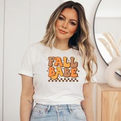 "Get into the Fall spirit by wearing this retro fall vibes t-shirt. Autumn is just around the corner and this cozy, oversized shirt is the perfect staple to add to your wardrobe. Groovy Fall Babe T-Shirt, Trendy Fall Vibes Shirt, Retro Fall Tee, Women's Oversized Shirt, Autumn Shirt, Halloween Women's T-Shirt, Cozy T-Shirt Description: * Please read shop \"Policies\" for more information. * Please note actual colors may vary. It's important to note that they may look different on a real product Halloween Cozy, Babe T Shirt, Fall Tee, Trendy Fall, Halloween Women, Fall Shirts, Oversized Shirt, Fall Vibes, Shop Policies