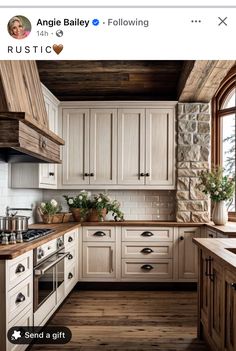 a kitchen with white cabinets and wood floors is featured in the instagram post on instagram