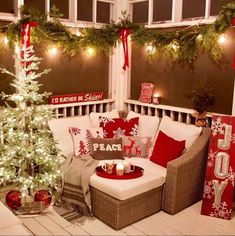 a decorated porch with christmas decorations and lights