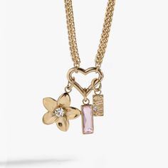 Our new, interchangeable necklace design lets you make the look all your own: swap out the charms or add more symbols to make a charm necklace that’s exactly your style. This Girl Mom Interchangeable Charm Necklace features a chunky gold wheat stitch chain with a heart-shaped charm clip at the center with a light rose baguette crystal charm, a flower charm and a “Girl Mom” charm. Wheat Stitch, Interchangeable Necklace, Light Rose, Necklace Design, Mom Necklace, Rose Lights, Crystal Charm, Girl Mom, Flower Charm