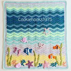 a crocheted dishcloth with fish and waves on the bottom, along with words cookie hooks