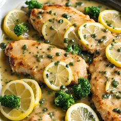 chicken with broccoli and lemons on a plate