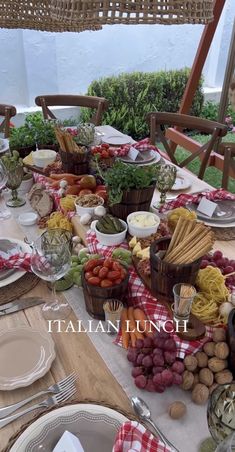 the table is set with many different types of food