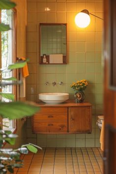 a bathroom with a sink, mirror and plants in the corner on the counter top