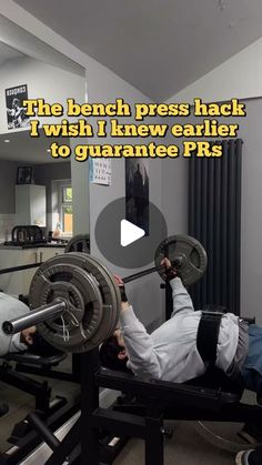 the bench press has two weight plates on it and one is holding a barbell