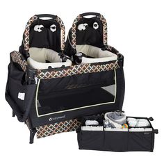 two baby cribs are shown next to the diaper bag and changing table