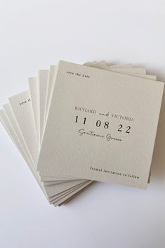 five wedding cards with the names and date printed on them