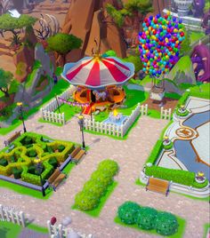 an aerial view of a park with a carousel and colorful balloons