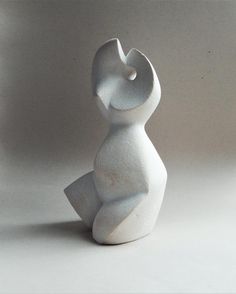 a white sculpture sitting on top of a table