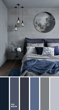 a bedroom with grey walls and blue bedding, gray rugs and white pillows