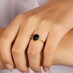 Black Onyx Ring, Natural Gemstone Ring, Onyx Ring, Black Stone Ring, Christmas Gift, Minimalist Ring, Gift For Mom, Mother's Day Gift This minimalist black onyx ring will be a perfect gift as a christmas for your best friend.Tigers eye ring with made of gold plated 18 karat .925 sterling silver. In ancient Indian and Persian tales Onyx is referred to as a protector from evil. The Indian gemologists describe onyx as a protector for harmonious relationships. The stones' close union and yet strong Black Birthstone Ring Gift, Black Birthstone Rings For Gifts, Black Birthstone Rings, Black Opal Ring With Cabochon As A Gift, Dainty Adjustable Black Ring, Black Opal Cabochon Ring As Gift, Dainty Black Adjustable Rings, Adjustable Black Dainty Ring, Elegant Black Opal Ring For Gift