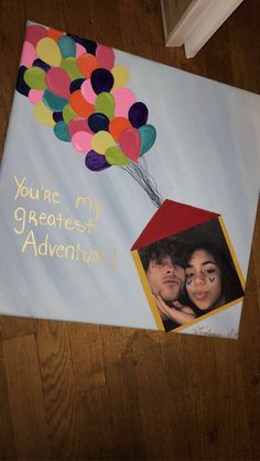 a birthday card with a photo and balloons on the front, which reads you're my greatest adventure