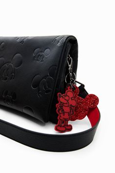 A midsize crossbody bag with a flap and multiple compartments and pockets. Featuring leather-effect fabric embossed with Disney's Mickey Mouse. Very soft leather-effect fabric with tone-on-tone silhouettes of Disney's Mickey Mouse Multiple inside and outside pockets Magnetic flap and zip closure on one side Two compartments Two straps Short handle for using as a clutch Long, adjustable, detachable strap for carrying across the body Keyring with contrasting Disney's Mickey Mouse charms 27.5 x 6 x Disney Bags Backpacks, Disney Trip Outfits, Mickey Mouse Bag, Disney Bag, Pretty Bags, Crossbody Bag Women, Original Clothes, Original Bags, Disney Outfits