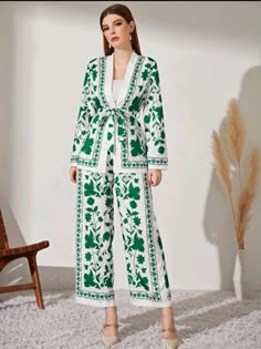 SHEIN Modely Floral Print Belted Coat & Wide Leg Pants  • I discovered amazing products on SHEIN.com, come check them out!  • http://api-shein.shein.com/h5/sharejump/appjump?link=ViHZON0y6Vd&localcountry=LK&url_from=GM7414352072182689792 Classic Outfits For Women, Long Skirt Casual, Batwing Blouse, Patch Work Blouse, Belted Coat, Shoulder Shirts