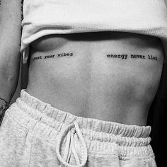 a woman's stomach with the words energy never lies written on her lower back