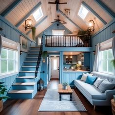 a living room filled with furniture and stairs