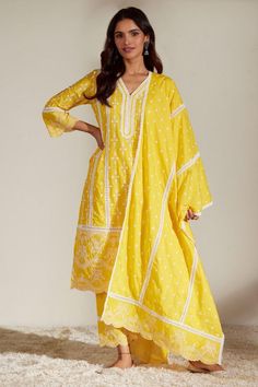 Buy #yellow #kurta with V neckline, scallop hem & #floral embroidery. Paired with embroidered pant & embroidered #dupatta by #Mulmul at #AzaFashions Shop online now at #Azafashions.com Call +91 8291990059 or email contactus@azafashions.com for enquiries. #wedding #festive #ethnic #tradional #shopping #shoponline #party Latest Dress Patterns, Running Embroidery, Indian Closet, Cotton Churidar, Jain Recipes, Long Blouse Designs, Yellow Kurta, Character Wardrobe, Traditional Attires