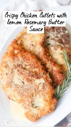 crispy chicken bites with lemon rosemary butter sauce on a white plate next to a fork