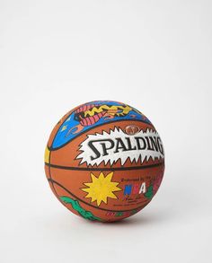 a basketball with the word spalding painted on it's front and bottom half