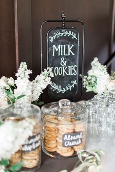 a table with cookies and jars on it