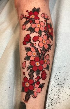 a person with a flower tattoo on their leg