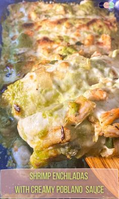 shrimp enchiladas with creamy poblano sauce on a wooden spatula