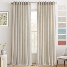 a living room with white curtains and wood flooring in front of a large window