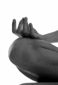 black and white photograph of a woman's back with her hands in the air