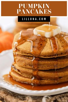 a stack of pumpkin pancakes with syrup drizzled on top